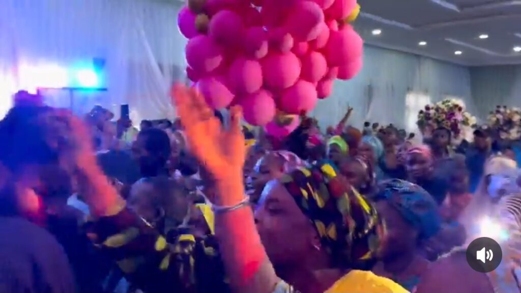 Fans React to Umar M Shareef's Surprise Show in Kano Photo of the crowd from the back with stage lights in the distance