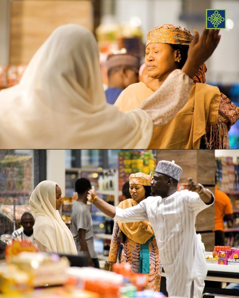 Two Hausa artists arguing during a music video shoot